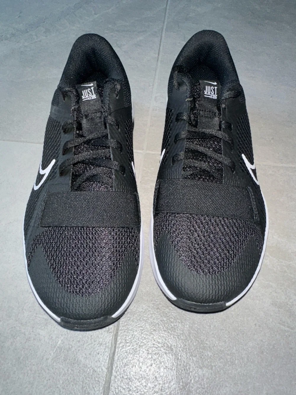 Nike Black Athletic Shoes with White Swoosh